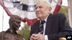 Griffith near bronze statue of Andy and Opie from 'The Andy Griffith Show,' Raleigh, N.C., Oct. 28, 2003.
