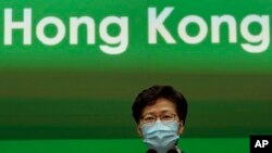 Hong Kong Chief Executive Carrie Lam listens during a press conference held in Hong Kong, May 5, 2020. During the briefing, Lam and other officials sported a new mask that they said would be distributed to all residents in the coming weeks. 