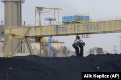 Coal is transported at a heating plant in Warsaw, Poland, March 2012.