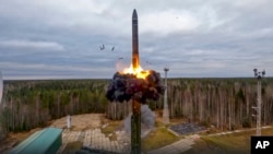 FILE - In an image from video released by Russian Defense Ministry Press Service on Oct. 26, 2022, a Yars intercontinental ballistic missile is test-fired as part of Russia's nuclear drills from a launch site in Plesetsk, northwestern Russia. 