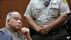 FILE - Samuel Little listens as he is sentenced to three consecutive terms of life in prison without parole for murdering three women in the late 1980s, in a Los Angeles courtroom, Sept. 25, 2014. 