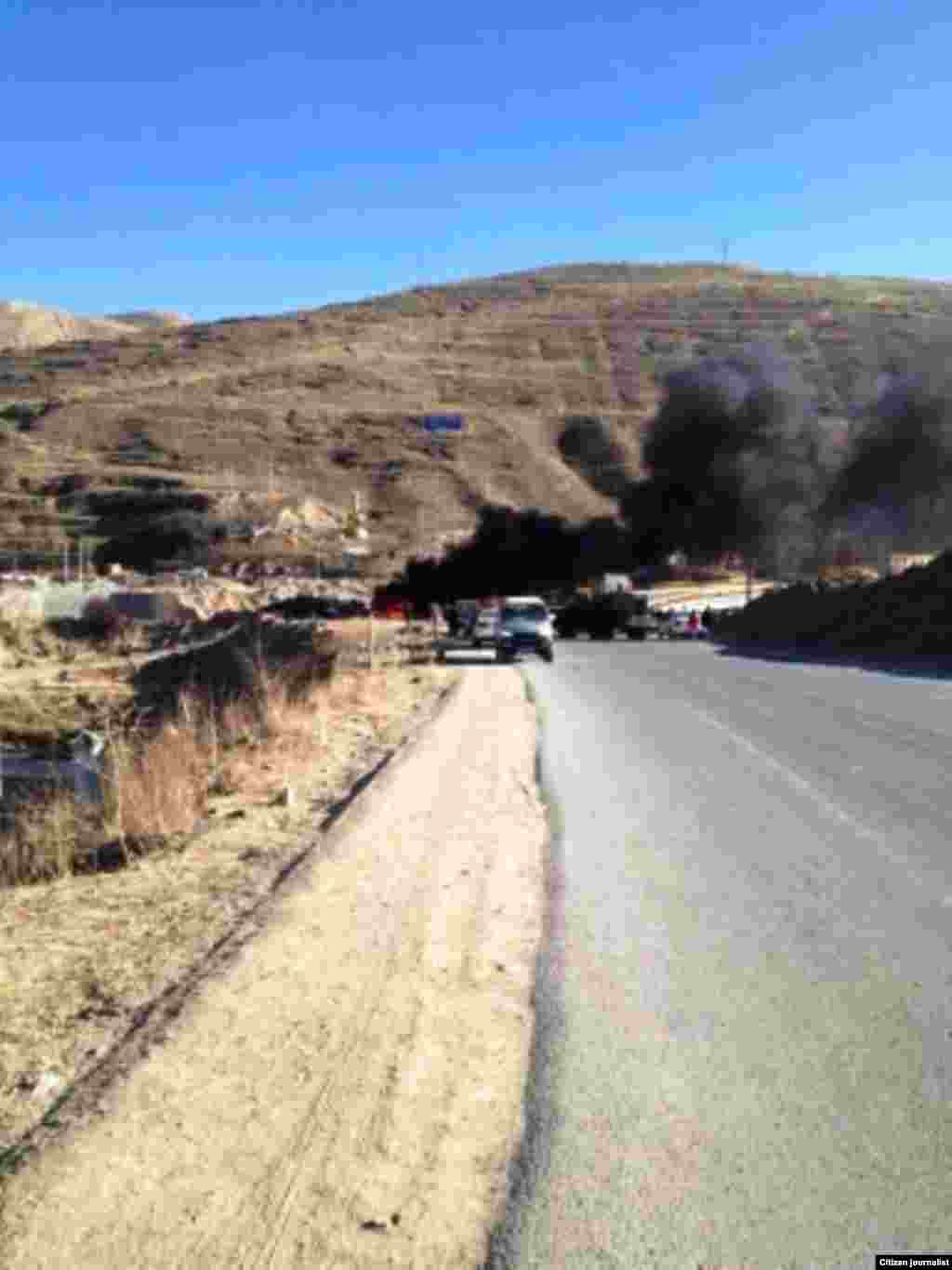 Smoke emitted by burning of satellite receivers. Photographs taken on the January 9.