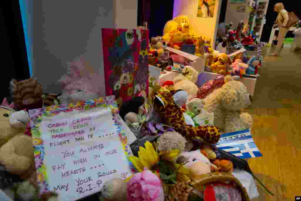 Articles and mementos at a memorial site for the victims of the MH17 air disaster at Schiphol Airport in Amsterdam, Netherlands, Sept. 9, 2014.