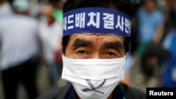 FILE - A Seoungju resident takes part in a protest against the government's decision on deploying a U.S. THAAD anti-missile defense unit in Seongju, in Seoul, South Korea, July 21, 2016. 