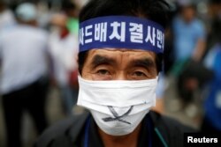A Seoungju resident takes part in a protest against the government's decision on deploying a U.S. THAAD anti-missile defense unit in Seongju, in Seoul, South Korea, July 21, 2016.