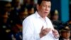 Philippines President Rodrigo Duterte gestures while addressing police force to mark the 117th Philippine National Police Service anniversary at Camp Crame in Quezon city northeast of Manila, Aug. 8, 2018.