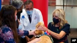 FILE - First lady Jill Biden visits with kids at a pediatric COVID-19 vaccine clinic in Texas Children's Hospital, in Houston, Nov. 14, 2021.