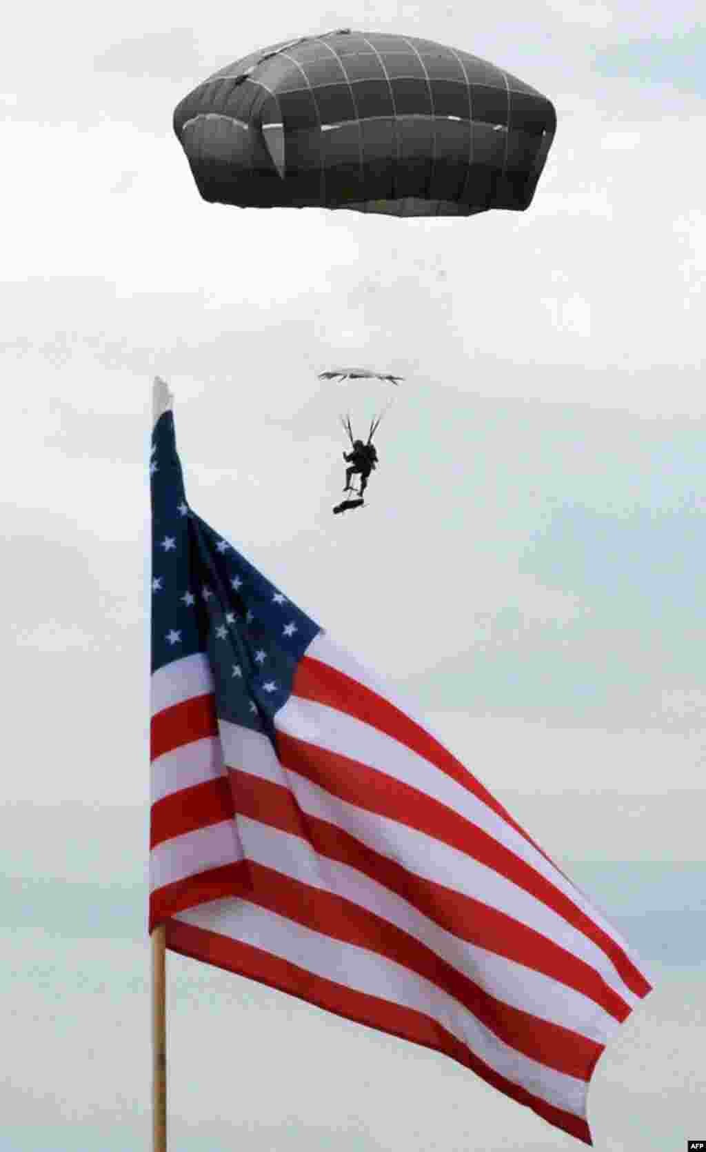 A paratrooper of the 173rd Airborne Brigade comes in to land during an official opening ceremony of the joint U.S.-Georgian exercises named Noble Partner 2015 at the Vaziani training ground outside Tbilisi.