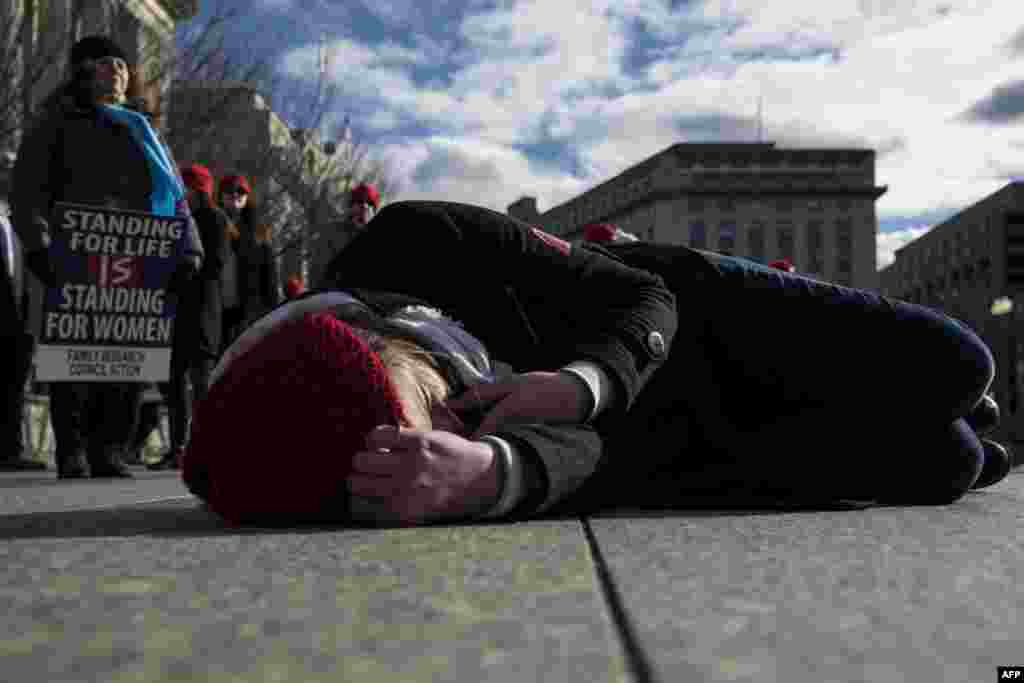 Abortion opponents participate in a &quot;die-in&quot; in front of the White House, Jan. 27, 2017, in Washington, D.C.