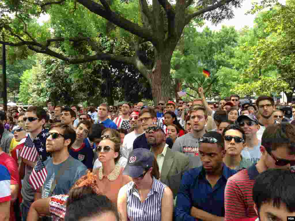 Fans watch the match.