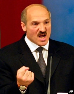 FILE - Belarusian President Alexander Lukashenko gestures while speaking at an election rally in the Republic Palace in Minsk, Belarus, on Sept. 4, 2001, before winning a second term.