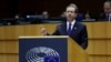 Presiden Israel Isaac Herzog menyampaikan pidato di depan anggota parlemen Uni Eropa dalam peringatan mengenang tragedi Holocaust di Brussels, Belgia, pada 26 Januari 2023. (Foto: Reuters/Yves Herman)