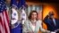 House Speaker Nancy Pelosi of Calif., with House Majority Whip James Clyburn of S.C., back right, speaks during a news conference on Capitol Hill, May 27, 2020, in Washington.