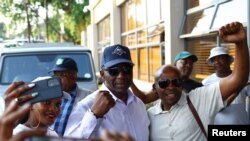 FILE - Sam Matekane, a millionaire diamond magnate and leader of Lesotho's Revolution For Prosperity (RFP), gestures before addressing his supporters following the Lesotho's parliamentary election in the capital Maseru, Lesotho, October 8, 2022