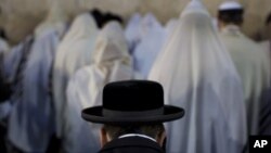 Ultra-Orthodox Jews pray at the Western Wall in Jerusalem's Old City, before the start the holiday of Rosh Hashana, Sept. 16, 2012.