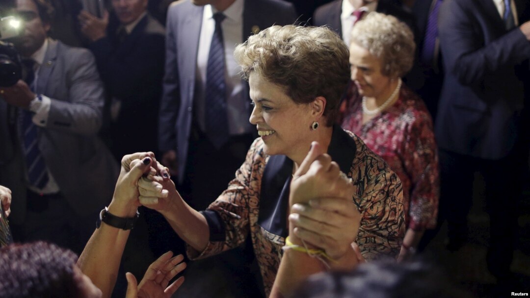 Brazil's President Dilma Rousseff greets women during a rally in support of her and against her impeachment in front of Planalto Palace in Brasilia, April 19, 2016.