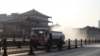 A truck sprays disinfectant on street in Xi'an in China's northern Shaanxi province, Dec. 31, 2021, amid a Covid-19 lockdown.