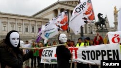 Demonstrators protest against the Comprehensive Economic Trade Agreement (CETA) in front of the Parliament in Vienna, Austria, Sept. 20, 2017. 