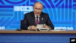 FILE - Russian President Vladimir Putin holds a press conference at a BRICS summit in Kazan, Russia, Oct. 24, 2024. 