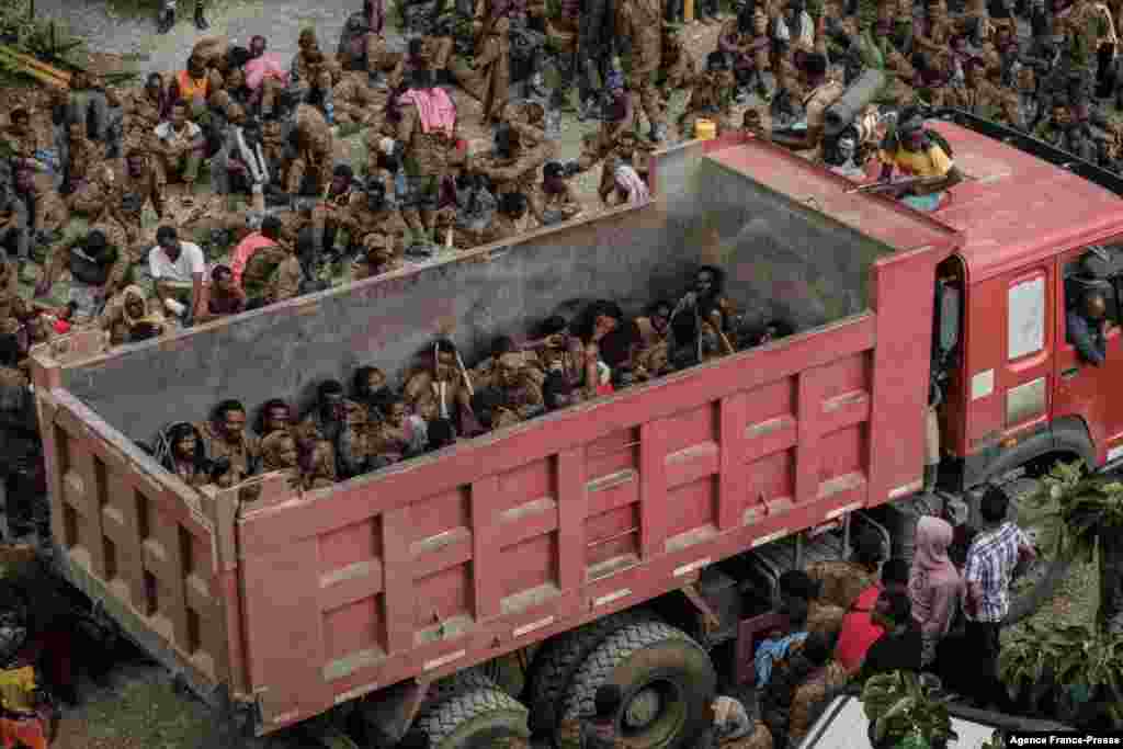 Wounded captive Ethiopian soldiers arrive on a truck at the Mekele Rehabilitation Center in Mekele, the capital of Tigray region, July 2, 2021. 