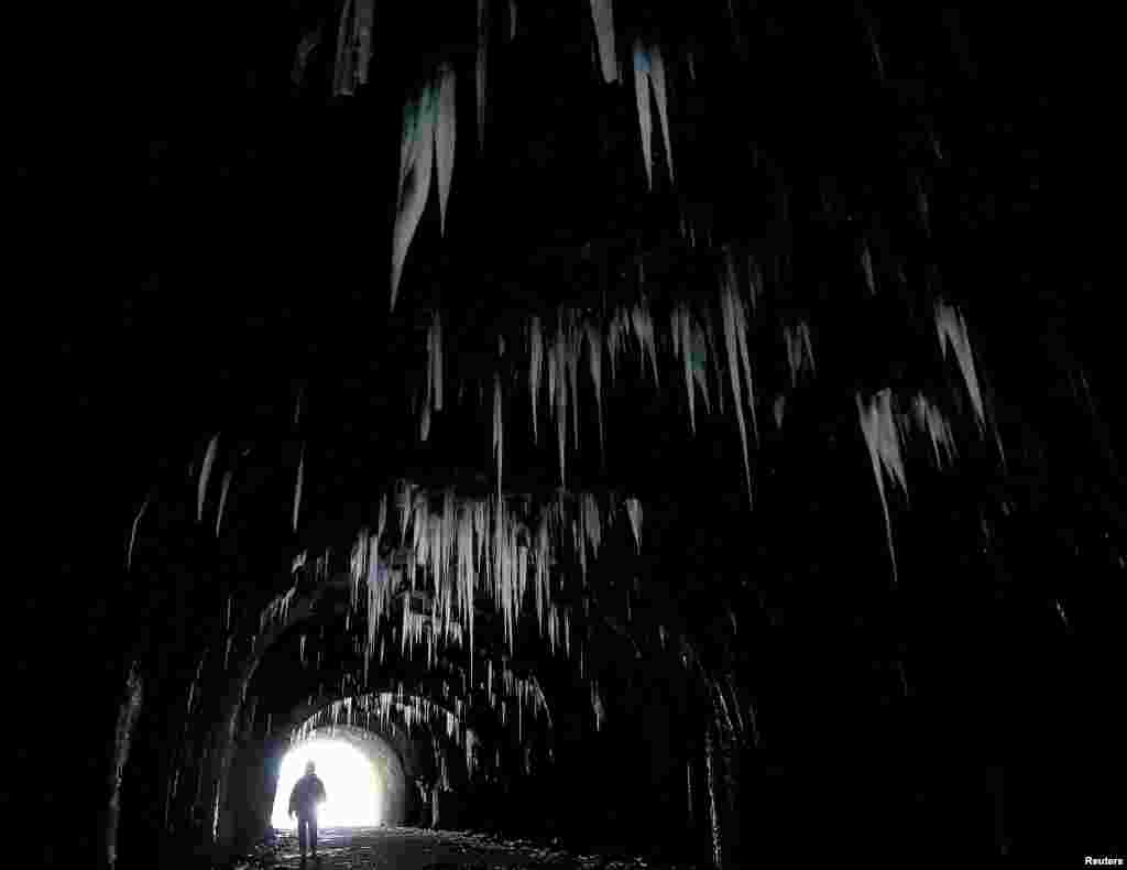 Icicles hang from the roof of Hopton Tunnel, near the village of Hopton, Derbyshire, Britain.