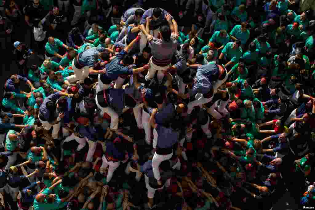 The group Colla els Capgrossos de Mataro forms a human tower called &#39;Castell&#39; during the All Saints Day in Vilafranca del Penedes town, near Barcelona, Spain, Nov. 1, 2017.