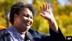 FILE - Stacey Abrams speaks at a campaign rally for Joe Biden at Turner Field in Atlanta, Nov. 2, 2020. 