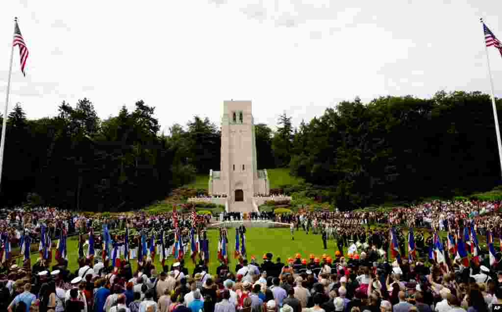 People attend a Memorial Day commemoration at the Aisne-Marne American Cemetery in Belleau, France, May 27, 2018.