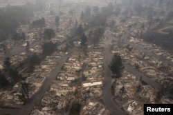 FILE - The gutted Medford Estates neighborhood is seen in the aftermath of the Almeda Fire in Medford, Oregon, Sept. 11, 2020.