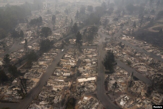 FILE - The gutted Medford Estates neighborhood is seen in the aftermath of the Almeda Fire in Medford, Oregon, Sept. 11, 2020.