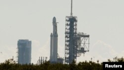 SpaceX's first Falcon Heavy rocket sits on launch pad 39A at Kennedy Space Center, waiting for the first engine test firing its 27 engines together, in Cape Canaveral, Fla., Jan. 11, 2018.