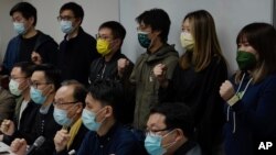 Pro-democratic party members shout slogans in response to the mass arrests during a press conference in Hong Kong Jan. 6, 2021. 