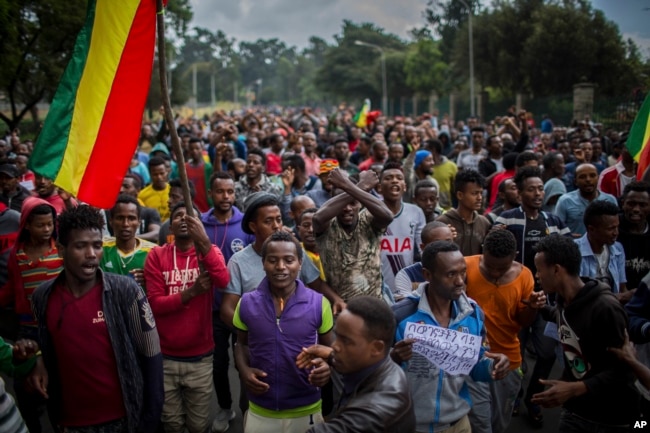 file - Thousands of protestors from the capital and those displaced by ethnic-based violence over the weekend in Burayu, demonstrate to demand justice from the government in Addis Ababa, Sept. 17, 2018.