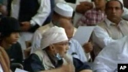 In this image taken from Libya's state TV, convicted Lockerbie bomber Abdel Baset al-Megrahi attends a pro-government rally in the Libyan capital of Tripoli, July 26, 2011