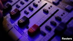 DJ Wika Szmyt controls the sound mixer as she plays music at a club in Warsaw January 4, 2012. Szmyt, 73, spends her retirement days behind a DJ console watching people dance to her rhythms. She plays disco, rumba or samba for a mostly elderly audience be