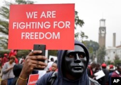 Kenyan activists and civil society groups protest in solidarity with Ugandan pop star-turned-lawmaker Kyagulanyi Ssentamu, also known as Bobi Wine, in a march to the Ugandan embassy in Nairobi, Kenya, Aug. 23, 2018.