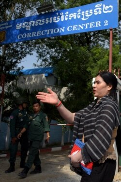 FILE - Cambodian land activist Tep Vanny speaks to journalists outside Prey Sar prison in Phnom Penh, Aug. 21, 2018.