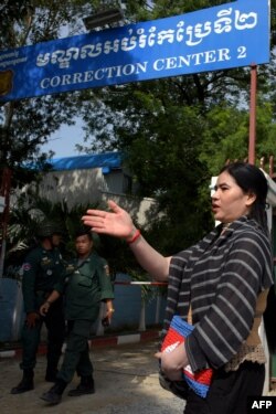 FILE - Cambodian land activist Tep Vanny speaks to journalists outside Prey Sar prison in Phnom Penh, Aug. 21, 2018.