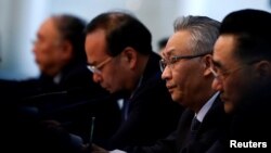 Mayor of Chongqing municipality Zhang Guoqing (2nd R) attends a session of the National People's Congress at the Great Hall of the People in Beijing, China March 6, 2017. 