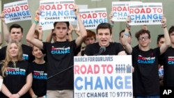 Cameron Kasky, center, speaks during a news conference in Parkland, Florida, June 4, 2018. A day after graduating from high school, a group of Florida school shooting survivors has announced a multistate bus tour to "get young people educated, registered and motivated to vote." 