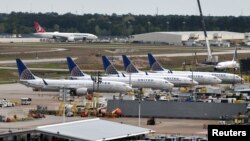 United Airlines planes, including a Boeing 737 MAX 9 model, are pictured at George Bush Intercontinental Airport in Houston, Texas, March 18, 2019. 