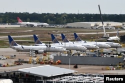 United Airlines planes, including a Boeing 737 MAX 9 model, are pictured at George Bush Intercontinental Airport in Houston, Texas, March 18, 2019.