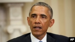 FILE - President Barack Obama speaks to members of the media prior to a meeting with Secretary of State John Kerry and Vice President Joe Biden in the Oval Office of the White House in Washington.