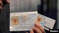 Pope Francis' new national identification card and passport are seen in this undated handout photo taken by Argentina's Interior Ministry and distributed, Feb. 17, 2014.