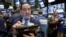 Trader Tommy Kalikas works on the floor of the New York Stock Exchange, Dec. 9, 2016. 