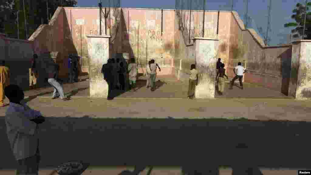 Youths play the Eton fives game in a court in the city of Katsina.