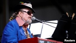 FILE - Dr. John performs during the New Orleans Jazz and Heritage Festival in New Orleans, April 26, 2013. 