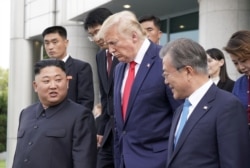 U.S. President Trump and North Korean leader Kim Jong Un meet at the Korean Demilitarized Zone. (Reuters)
