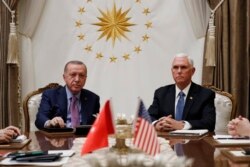 FILE - Vice President Mike Pence meets with Turkish President Recep Tayyip Erdogan at the Presidential Palace in Ankara, Turkey, Oct. 17, 2019.