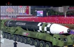 FILE - This image made from video broadcast by North Korea's KRT shows a military parade with what appears to be a possible new intercontinental ballistic missile at the Kim Il Sung Square in Pyongyang, Oct. 10, 2020.